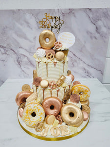 2 Tier Ivory, Rose gold & Gold cake with Doughnuts