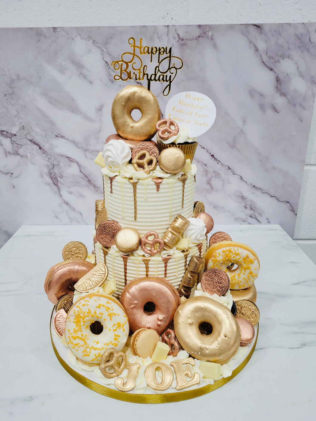 2 Tier Ivory, Rose gold & Gold cake with Doughnuts