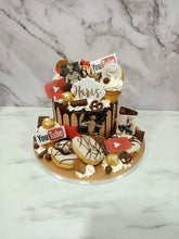 Load image into Gallery viewer, Gold &amp; Black Overload cake with cupcakes &amp; doughnuts
