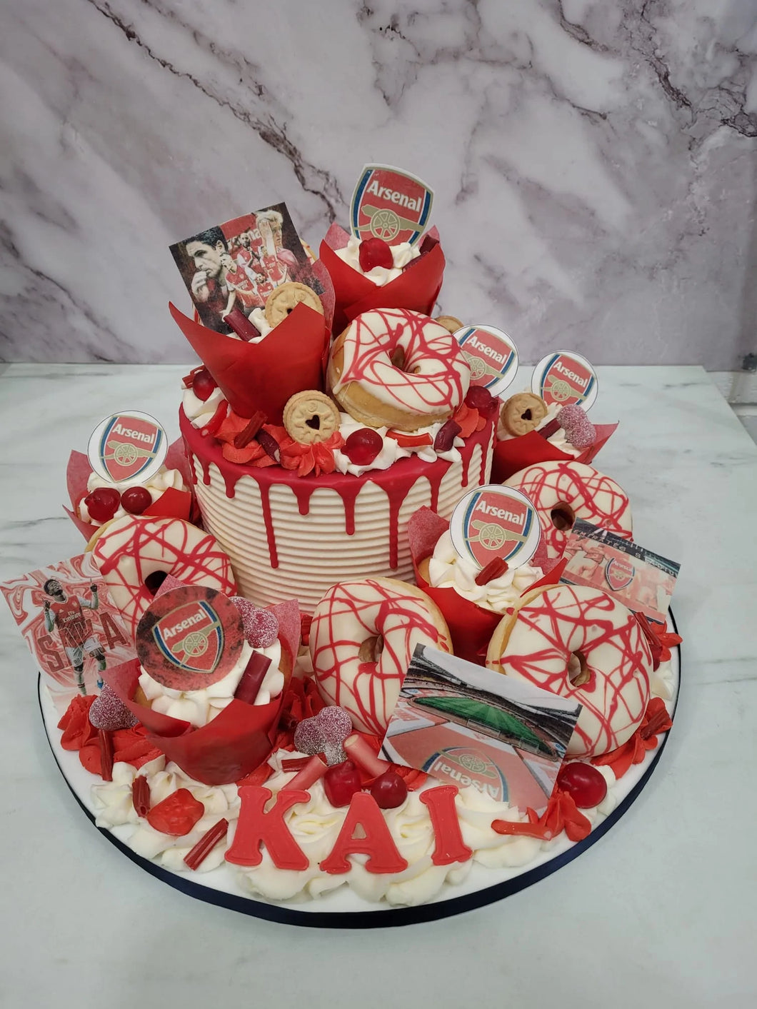 Football Overload cake with cupcakes & doughnuts