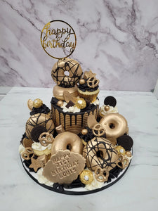Gold & Black Overload cake with cupcakes & doughnuts