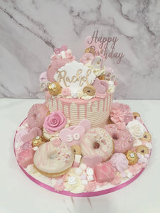 Gold & Black Overload cake with cupcakes & doughnuts