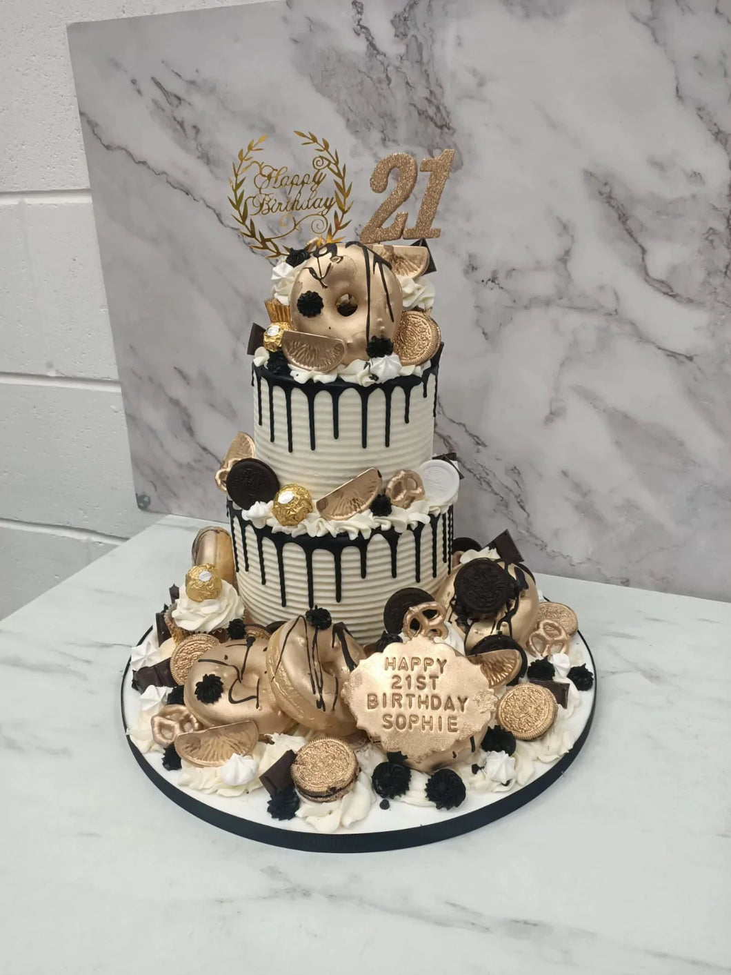 Black & Gold 2 Tier overload cake with Doughnuts