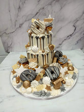 Load image into Gallery viewer, Black &amp; Gold 2 Tier overload cake with Doughnuts
